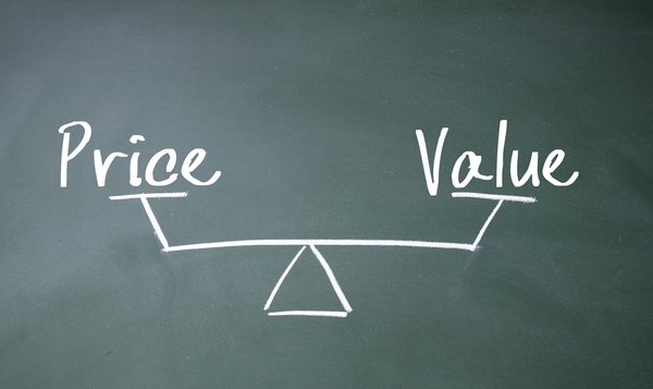 The words Value and Price at opposite ends of a balance drawn on a blackboard.